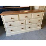 Pine and cream low chest of drawers, three short over four drawers