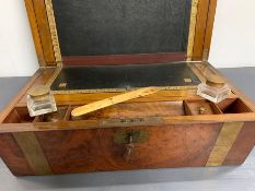 A Walnut writing box, brass banded, with original inkwells