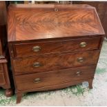 George III mahogany bureau, the slant front opening to an arrangement of drawers and pigeon holes (