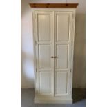 A large solid cream painted pine wardrobe with hanging rail (H230cm W91cm D58cm)