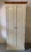 A large solid cream painted pine wardrobe with hanging rail (H230cm W91cm D58cm)