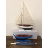 Two wooden model sailing boats