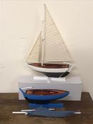 Two wooden model sailing boats