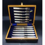 A Mother of Pearl Handled box set of six knives and forks