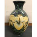 Highland stoneware vases decorated with lillies. H43cm