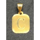 An 18 ct yellow gold C pendant