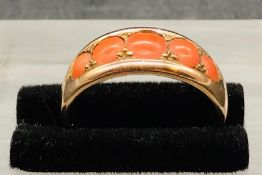 A Five stone coral and gold ring (4.2g)