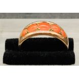 A Five stone coral and gold ring (4.2g)