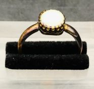 An Opal Ring on an 18 ct yellow gold setting