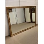 An extremely large bevelled gilt framed mirror (198cm x 140cm)