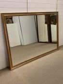 An extremely large bevelled gilt framed mirror (198cm x 140cm)