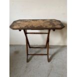 Campaign style table with carved fruit decoration to top (H74cm W80cm D36cm)