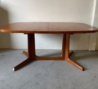 A large extending Danish dining table by Niels Moller of Gudme Mobel Fabrik Denmark