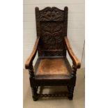 A Wainscot carved oak chair with arm supports and bobbin stretchers