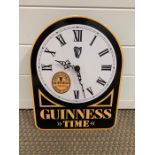 An enamel Guinness promotional wall clock