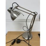 A metal adjustable table lamp
