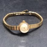A 9 ct Gold Ladies Record watch (Approx weight 21g)