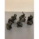 Six small carved elephants approx H9cm