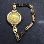 A 9 ct gold Ladies watch with rolled gold strap (Total weight 15.6g)