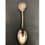 A Hallmarked silver golf themed spoon.