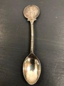 A Hallmarked silver golf themed spoon.