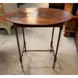 An oval side table (H71cm D44cm W69cm)