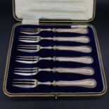 A Boxed set of six silver handled dessert forks.