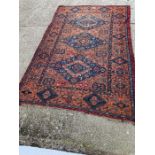 A Sumak Rug with wall hangings. (240cm x 370cm)