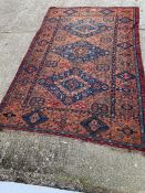 A Sumak Rug with wall hangings. (240cm x 370cm)