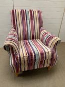 A Lounge armchair with striped upholstery