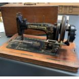 A Cased Antique Frister and Rossman sewing machine