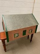 Tri-ang dolls house in the style of a bungalow 1950/60s. L70cm H42cm W50cm