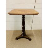 A mahogany occasional table with inswept triangular platform base (H75cm W55cm D45cm)