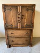 A Berick Oak cupboard with two drawers under (H108cm W68cm D46cm)