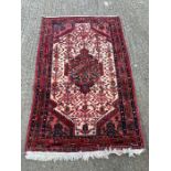 A Red Grounds rug, hand knotted, 170 x 109.