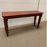 Mahogany hall bench on four balister on turned legs with with topple feet