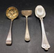 Three assorted silver items, spoon, sugar sifter and a child's food pusher.