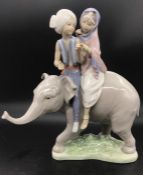 A Lladro Figure of an Elephant with Hindu Children riders.