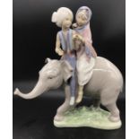 A Lladro Figure of an Elephant with Hindu Children riders.