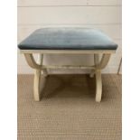 Dressing table stool with upholstered blue seat