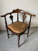 An inlaid corner chair with turned supports and legs