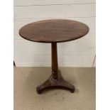 Pedestal table on tri form base