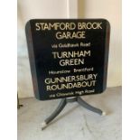 Tilt top table decorated with vintage London bus sign (H90cm W70cmsq)