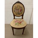 A mahogany bedroom chair with embroidered upholstery