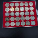 A Display case of 30 Commemorative crowns, includes four Five Pound Crowns and a 1951 Crown.