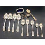 A Selection of silver items to include spoons and a salt.