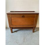 A mahogany satinwood cabinet on legs with hinged dropdown door revealing shelves (H68cm W84cm