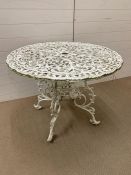 A wrought iron garden table (H67cm W90cm)