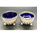 A Pair of silver, hallmarked, salts with blue glass liners