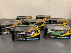 Seven Scalextric boxed cars